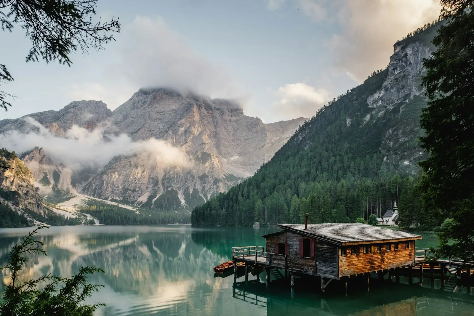 Wooden cabin beside a mountain lake