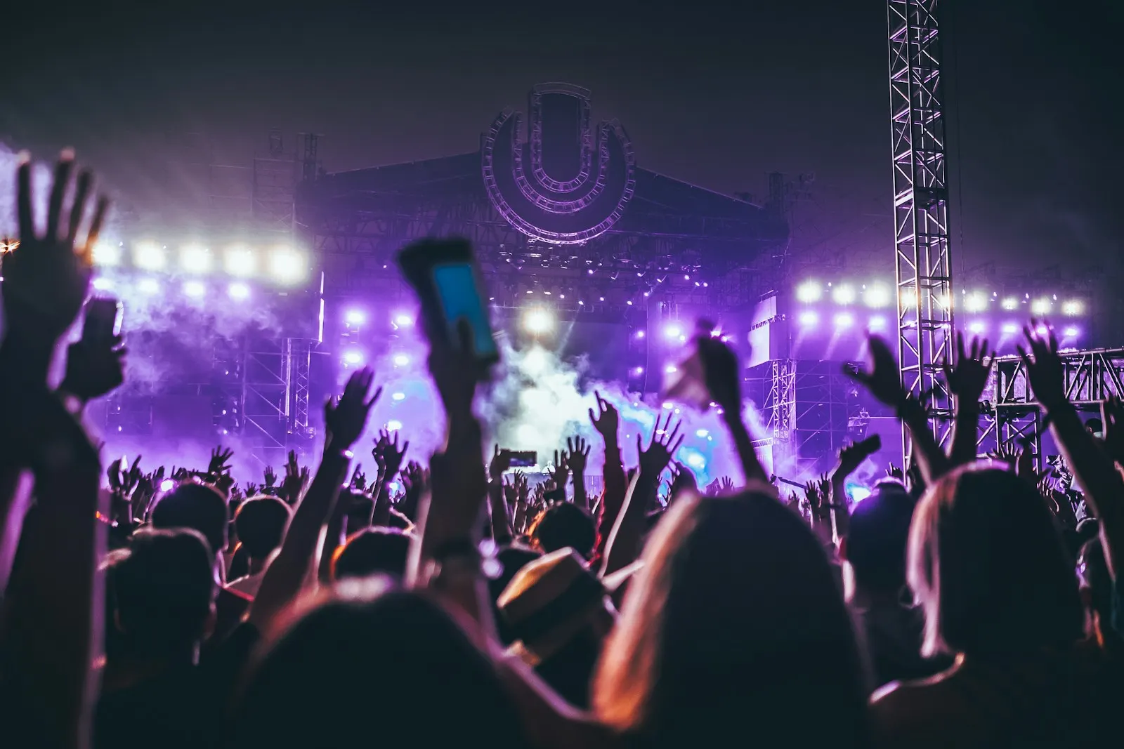Purple-lit concert stage and audience