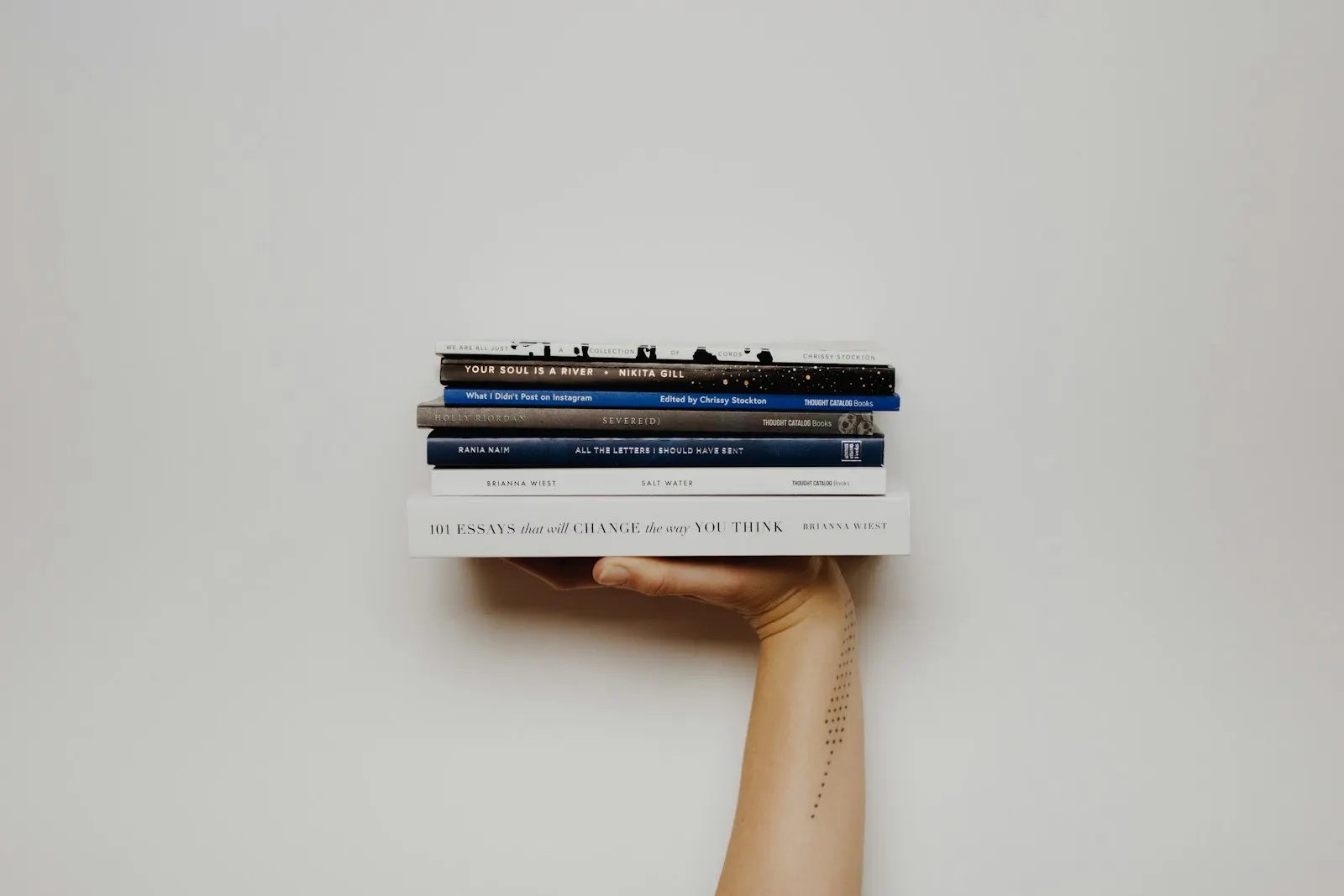 Stack of books on a small wall shelf