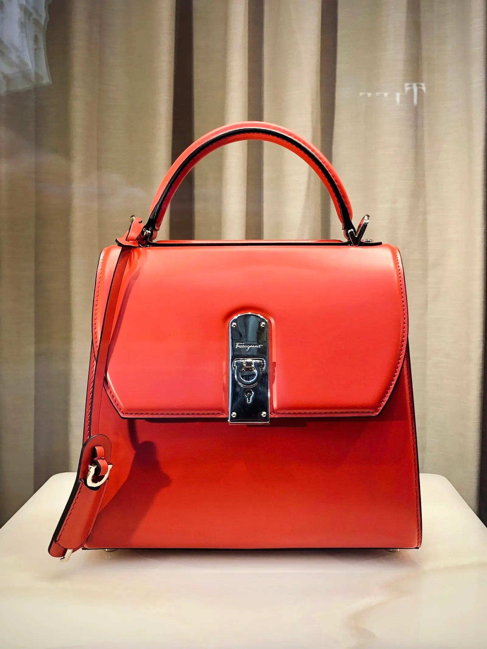 Red handbag on display
