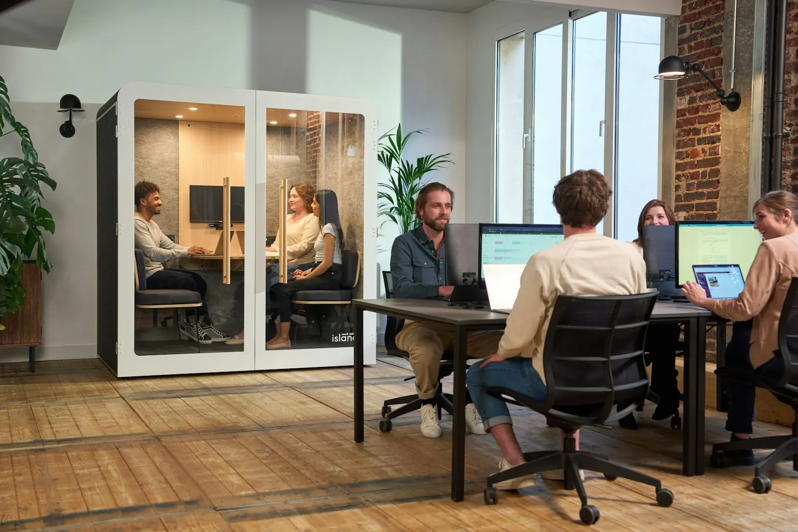 Colleagues meeting around an office table