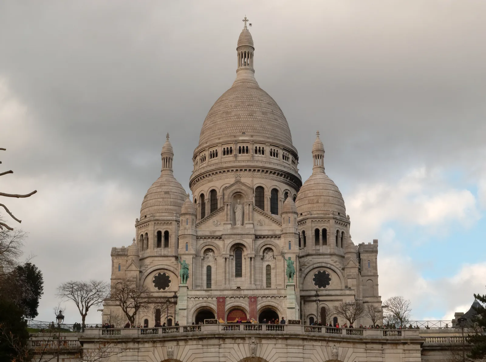 The Sacré-Cœur basilica façade and visitors in Montmartre, February 2016